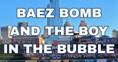 Baseball game with city skyline backdrop