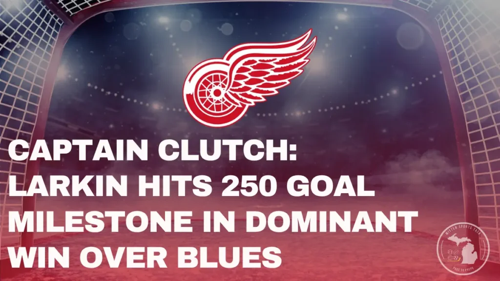 Detroit Red Wings goal net under arena lights with team logo above and headline text reading “Captain Clutch: Larkin Hits 250-Goal Milestone in Dominant Win Over Blues” — Mitten Sports Talk graphic
