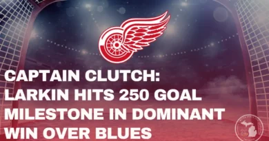 Detroit Red Wings goal net under arena lights with team logo above and headline text reading “Captain Clutch: Larkin Hits 250-Goal Milestone in Dominant Win Over Blues” — Mitten Sports Talk graphic