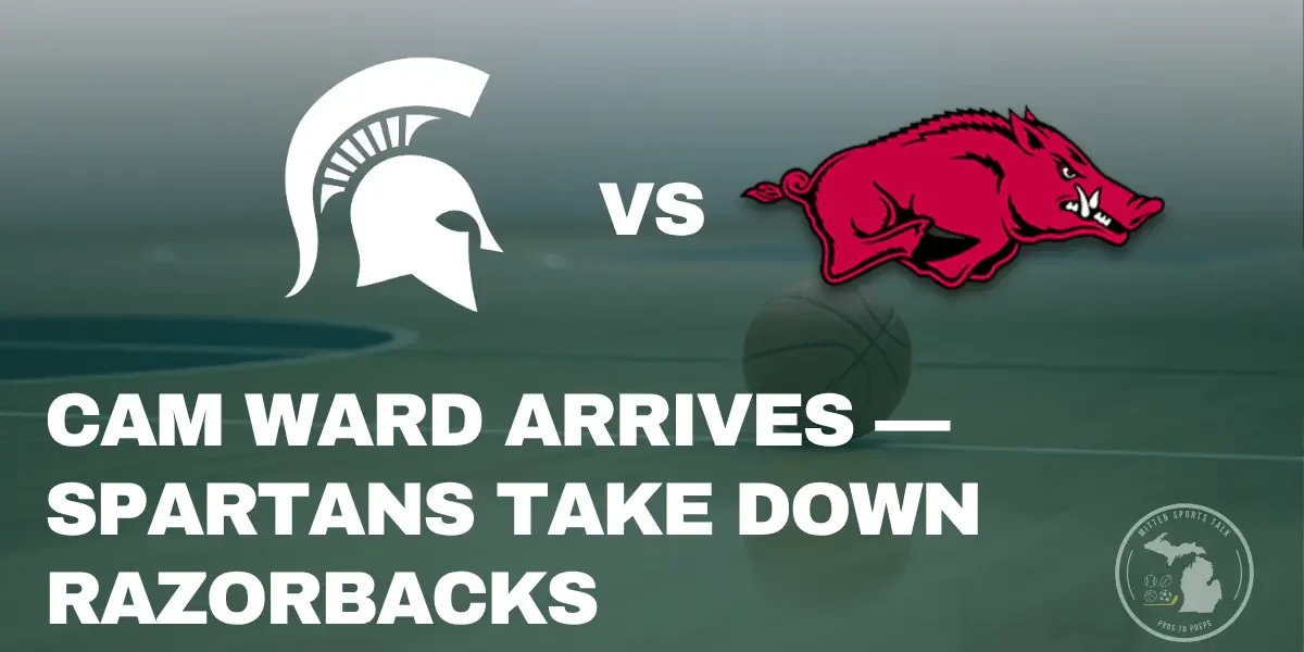 Freshman Cam Ward of Michigan State shoots a layup against Arkansas defenders during a packed game at the Breslin Center.