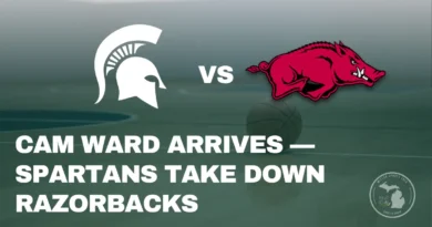 Freshman Cam Ward of Michigan State shoots a layup against Arkansas defenders during a packed game at the Breslin Center.