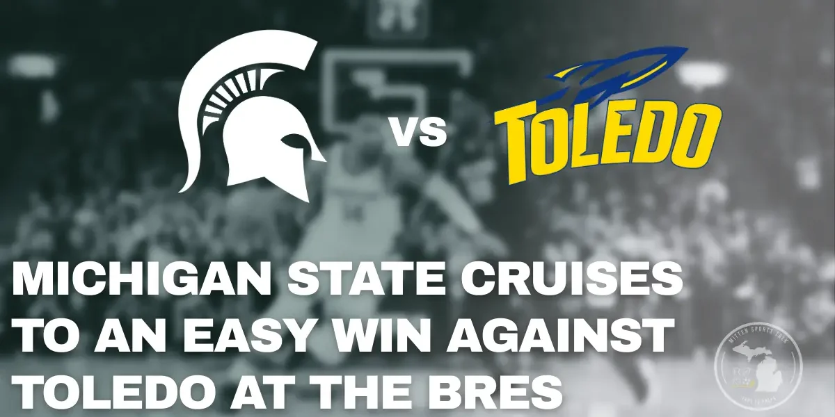 Michigan State players celebrate during a 92-69 win over Toledo at the Breslin Center