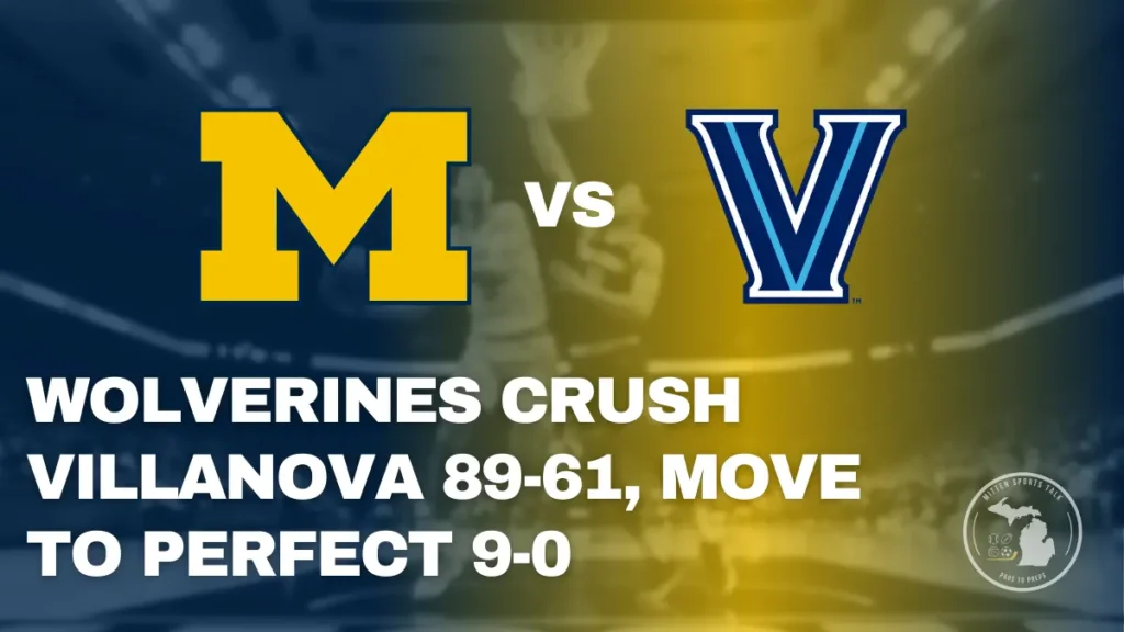 Michigan Wolverines guard Elliot Cadeau driving to the basket against a Villanova Wildcats defender during the game at Crisler Center.