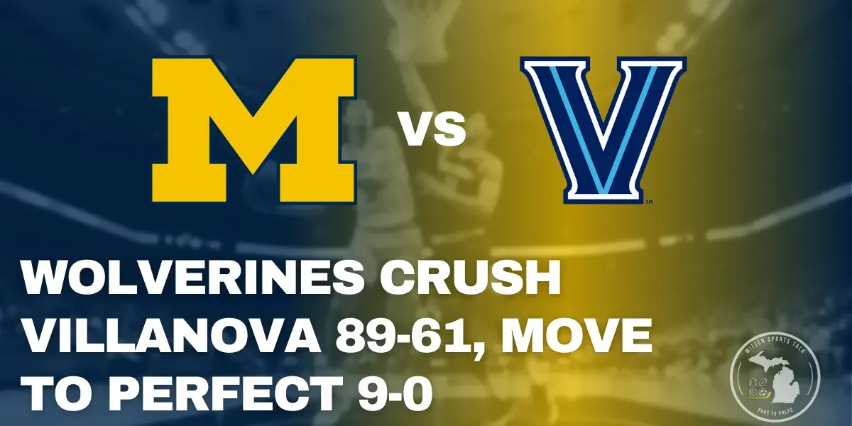 Michigan Wolverines guard Elliot Cadeau driving to the basket against a Villanova Wildcats defender during the game at Crisler Center.