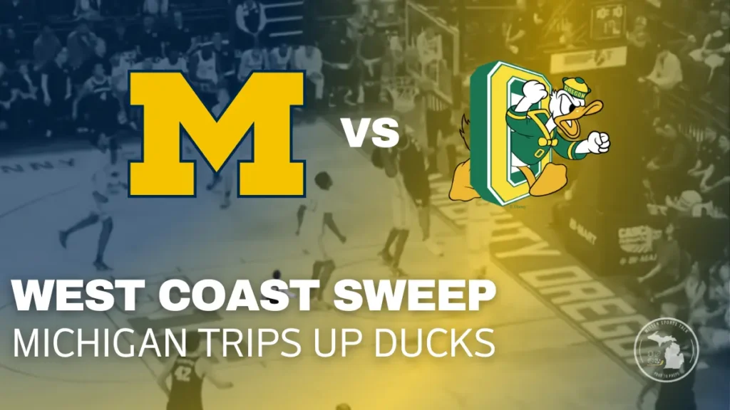 Aday Mara dunks over an Oregon defender as Michigan pulls away in its 81–71 road win at Matthew Knight Arena.