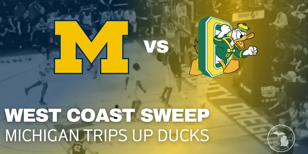 Aday Mara dunks over an Oregon defender as Michigan pulls away in its 81–71 road win at Matthew Knight Arena.